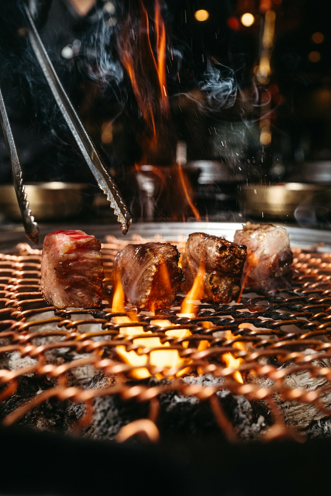 gallery-03 a-close-up-of-a-grill-with-meat-on-it-dkgav3wllwu
